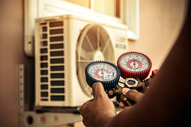 Professional Air Conditioning Service technician working in Benld, IL
